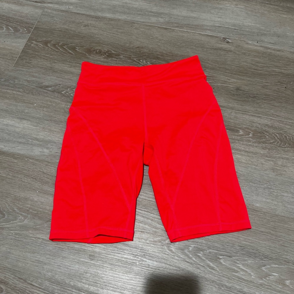 Free People Movement Biker Shorts in Orange.
